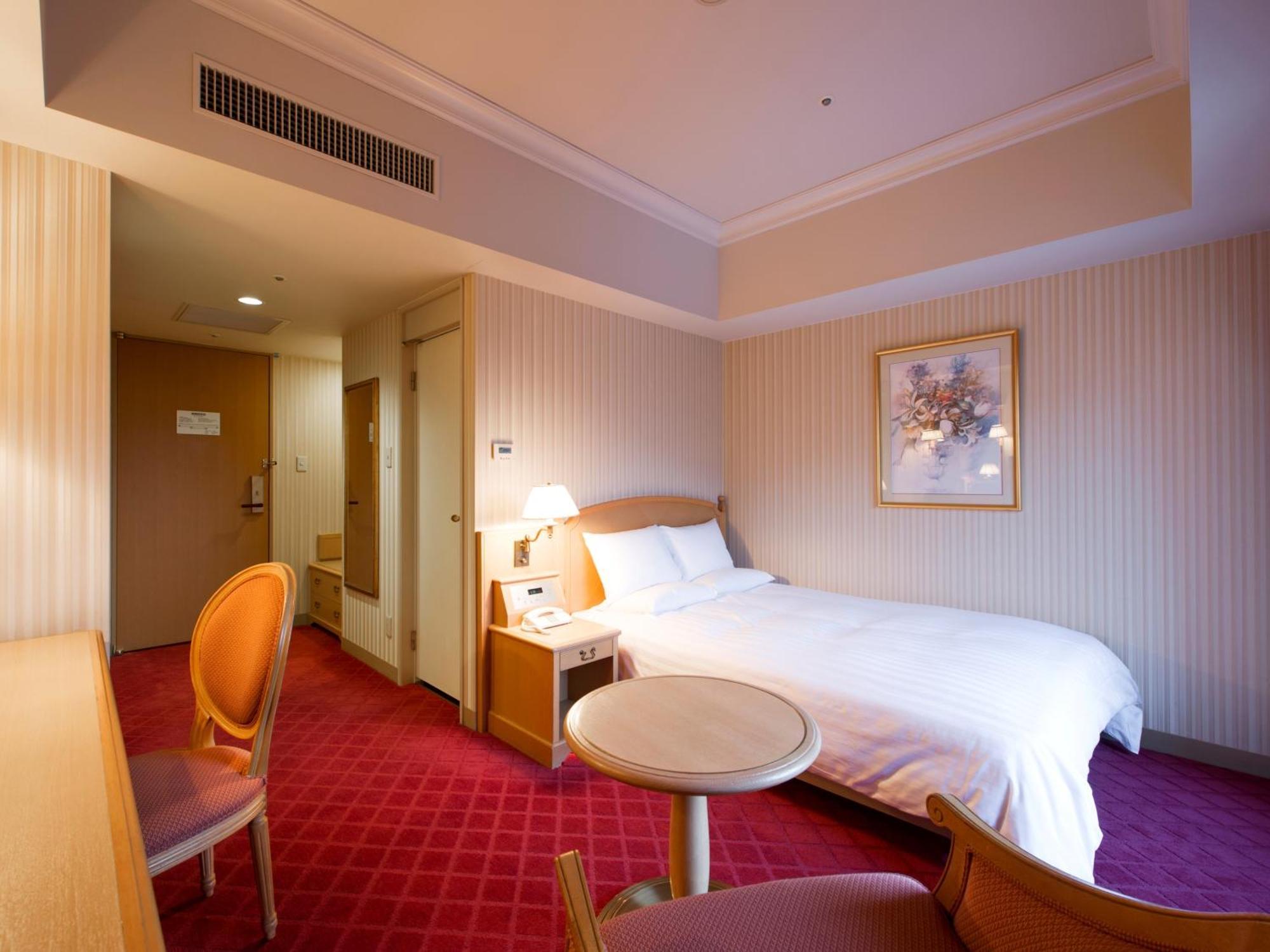 Hotel Okura Jr Huis Ten Bosch Sasebo Exterior foto A room at the hotel